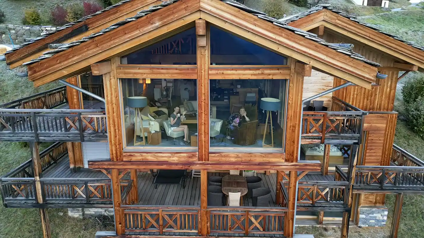The glass gable from outside, with the living room behind it