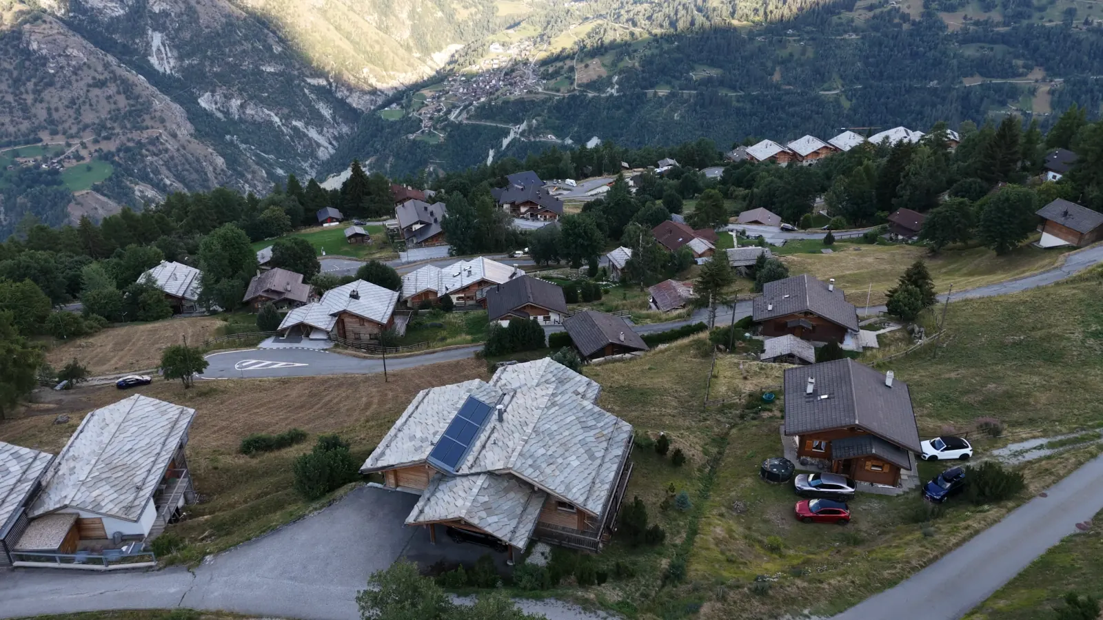 The chalet roof from our drone, then the view over the peaks and the valley