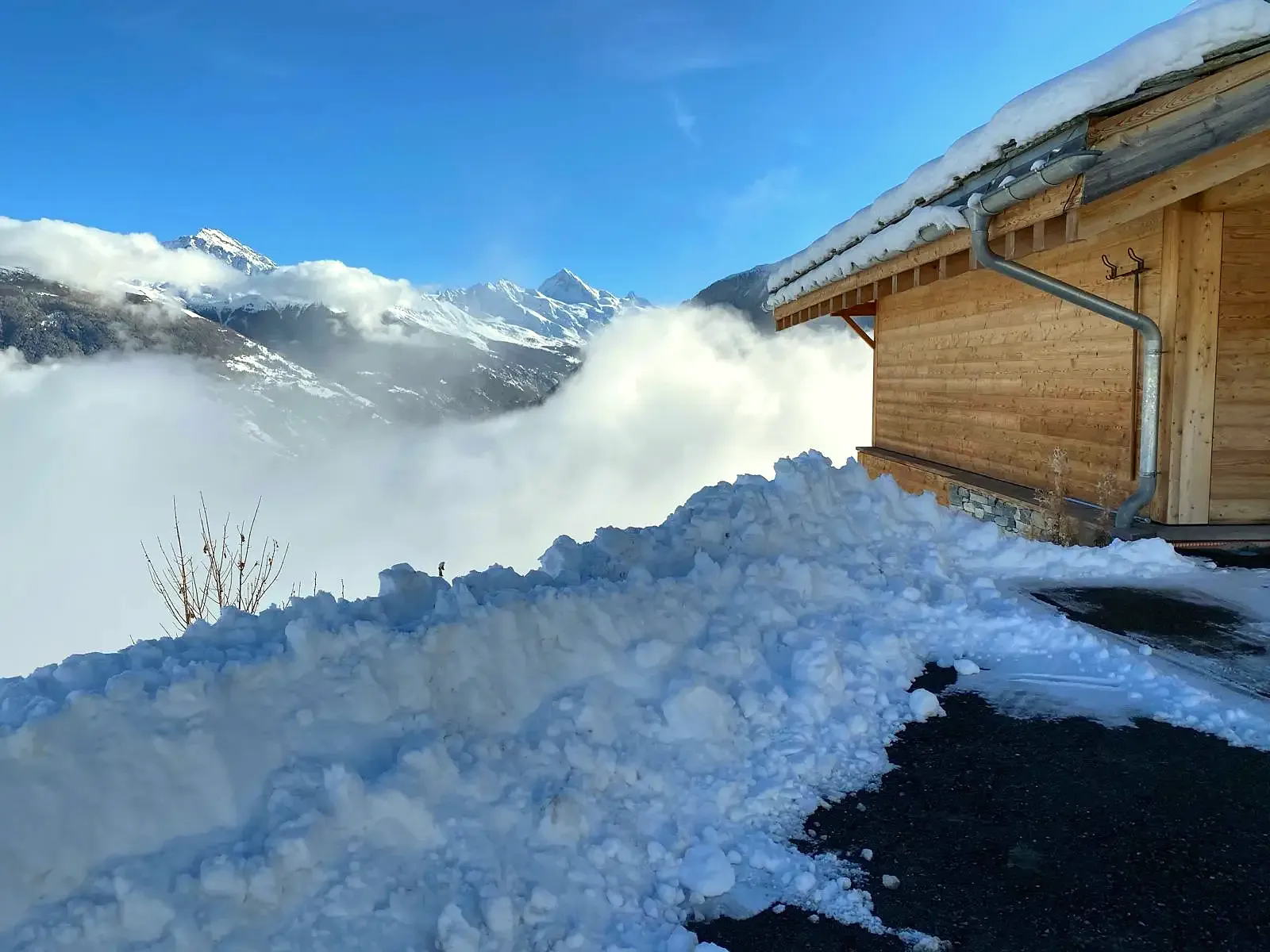 Sea of clouds below the chalet after fresh snow