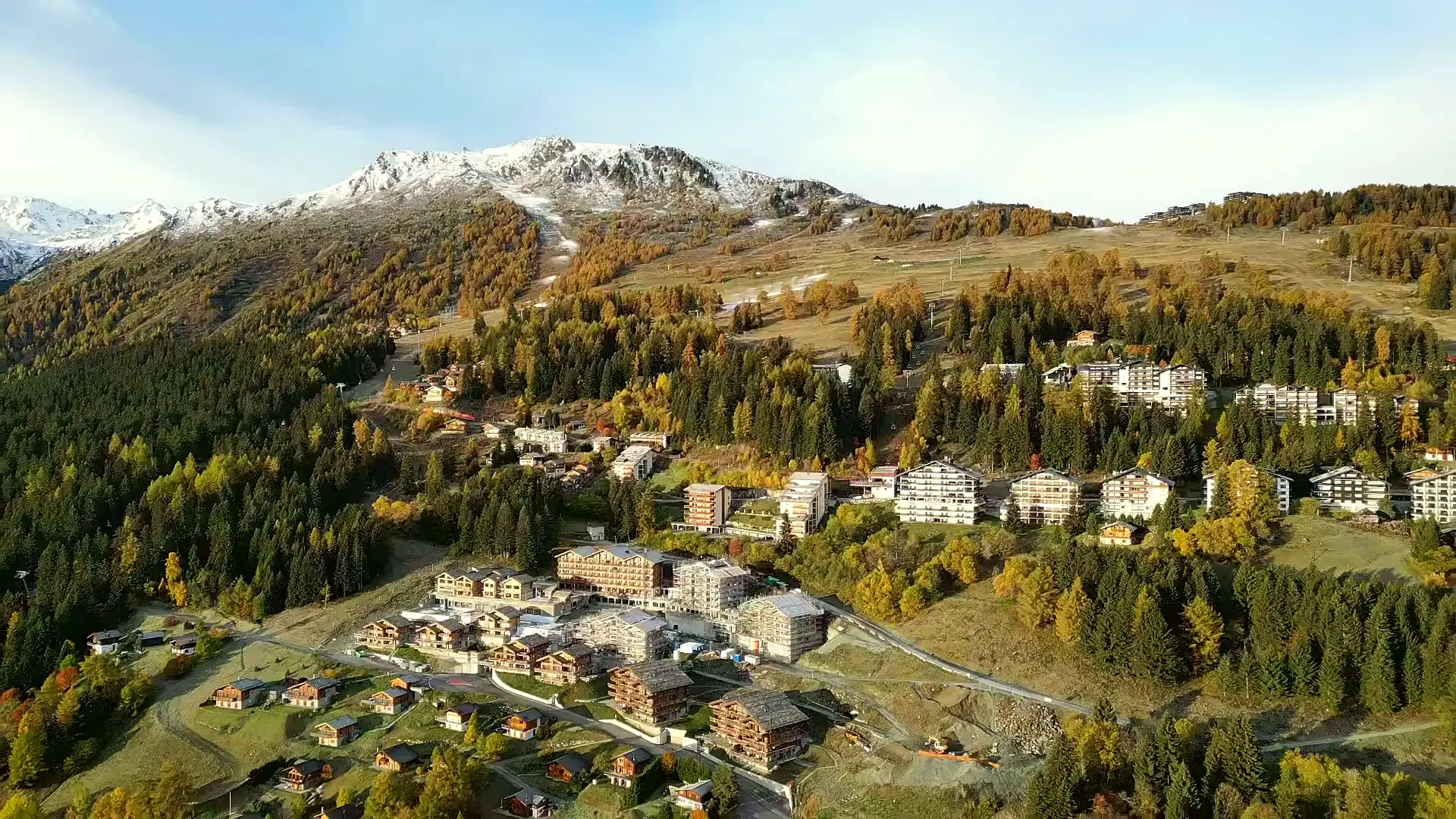 Les Collons in autumn from our drone, with the slopes rising towards Thyon